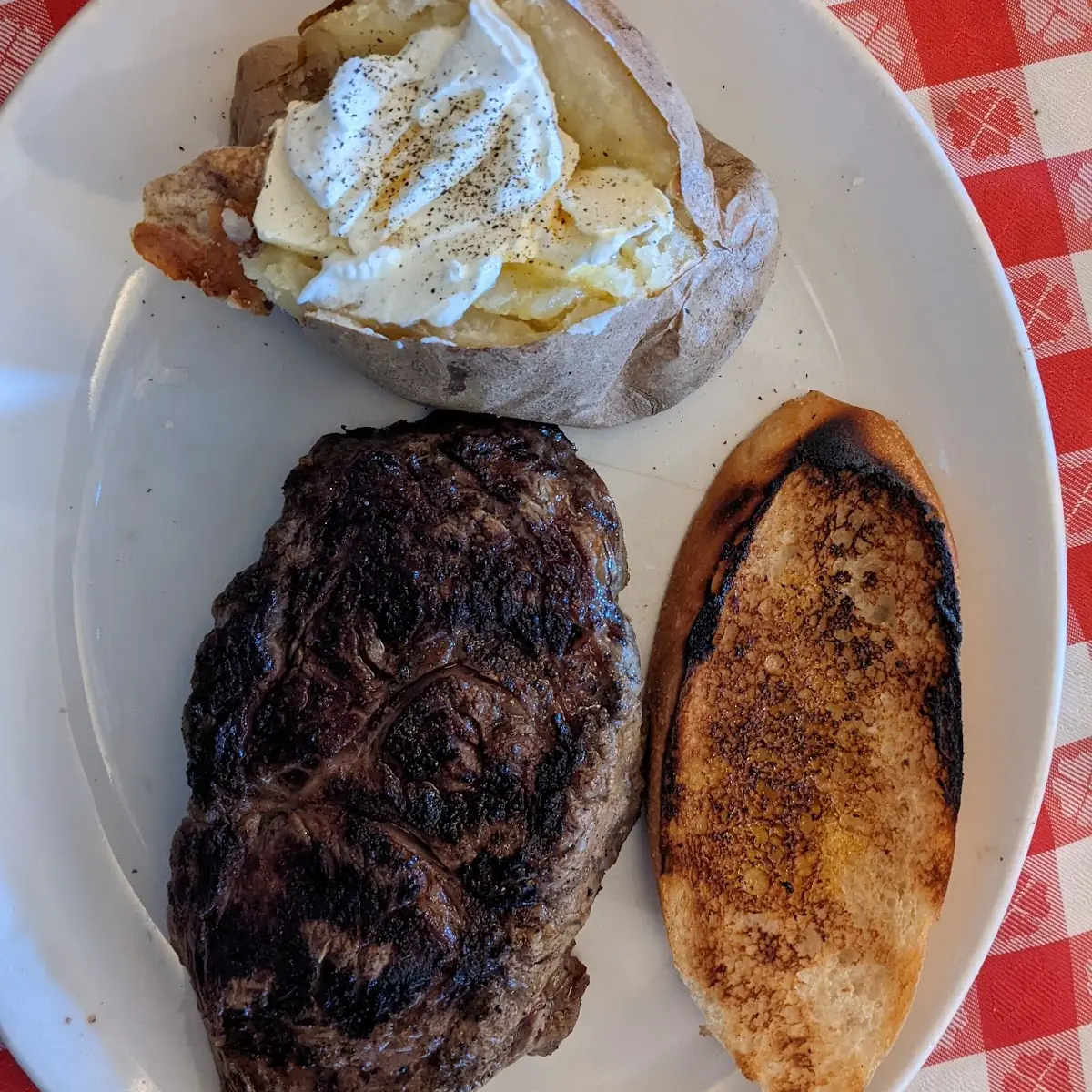 10 Oz Ribeye Steak with Baked Potato