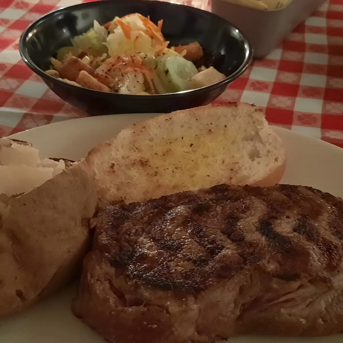 14 Oz Rib Eye Baked Potato and Garlic Bread