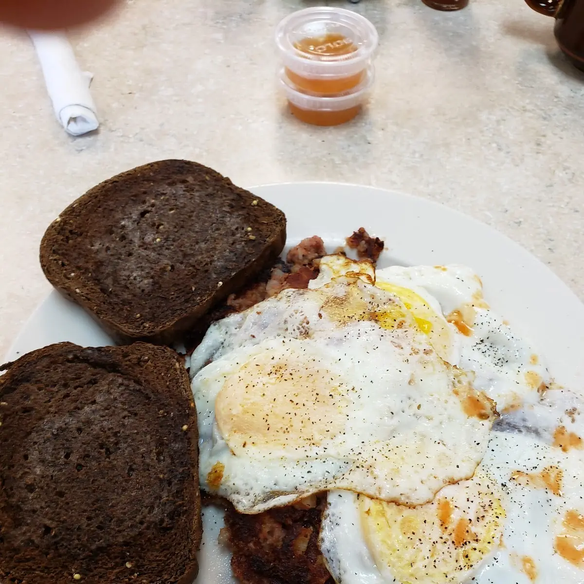 Over Easy on Corned Beef Hash with Homemade Rye Toast