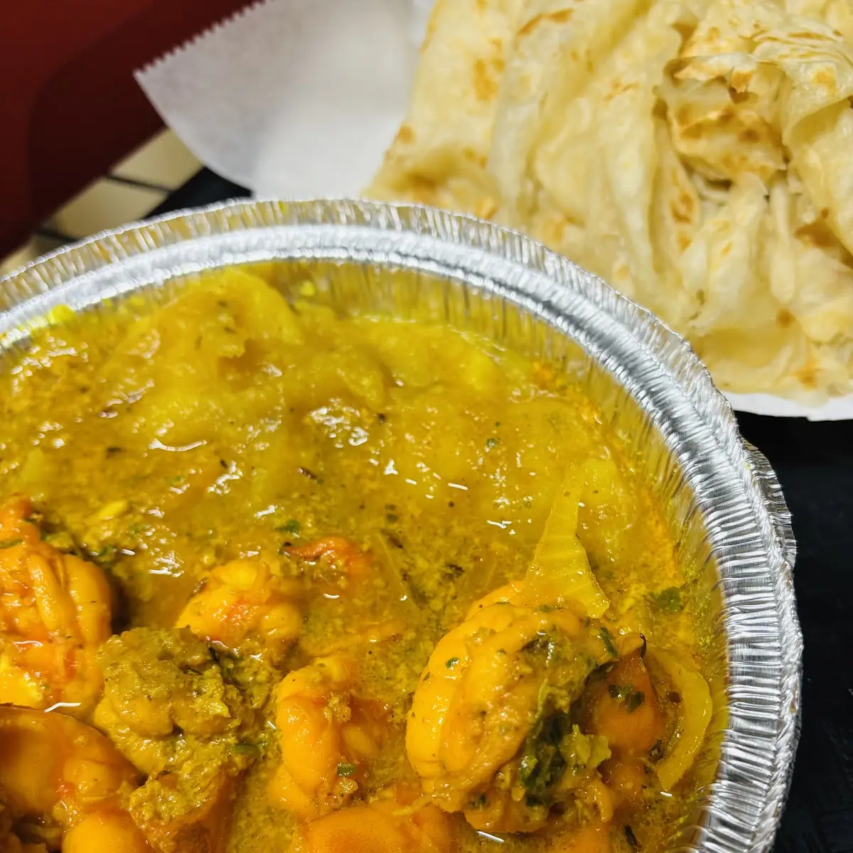 Curry Goat or Curry Shrimp Roti