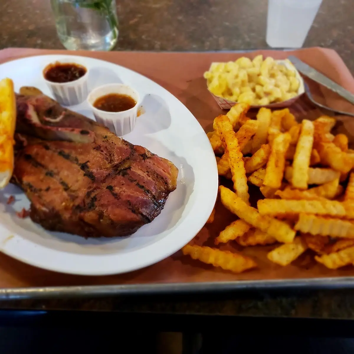Pork Steak Platter w Mac & Cheese Fries Garlic Cheese Bread