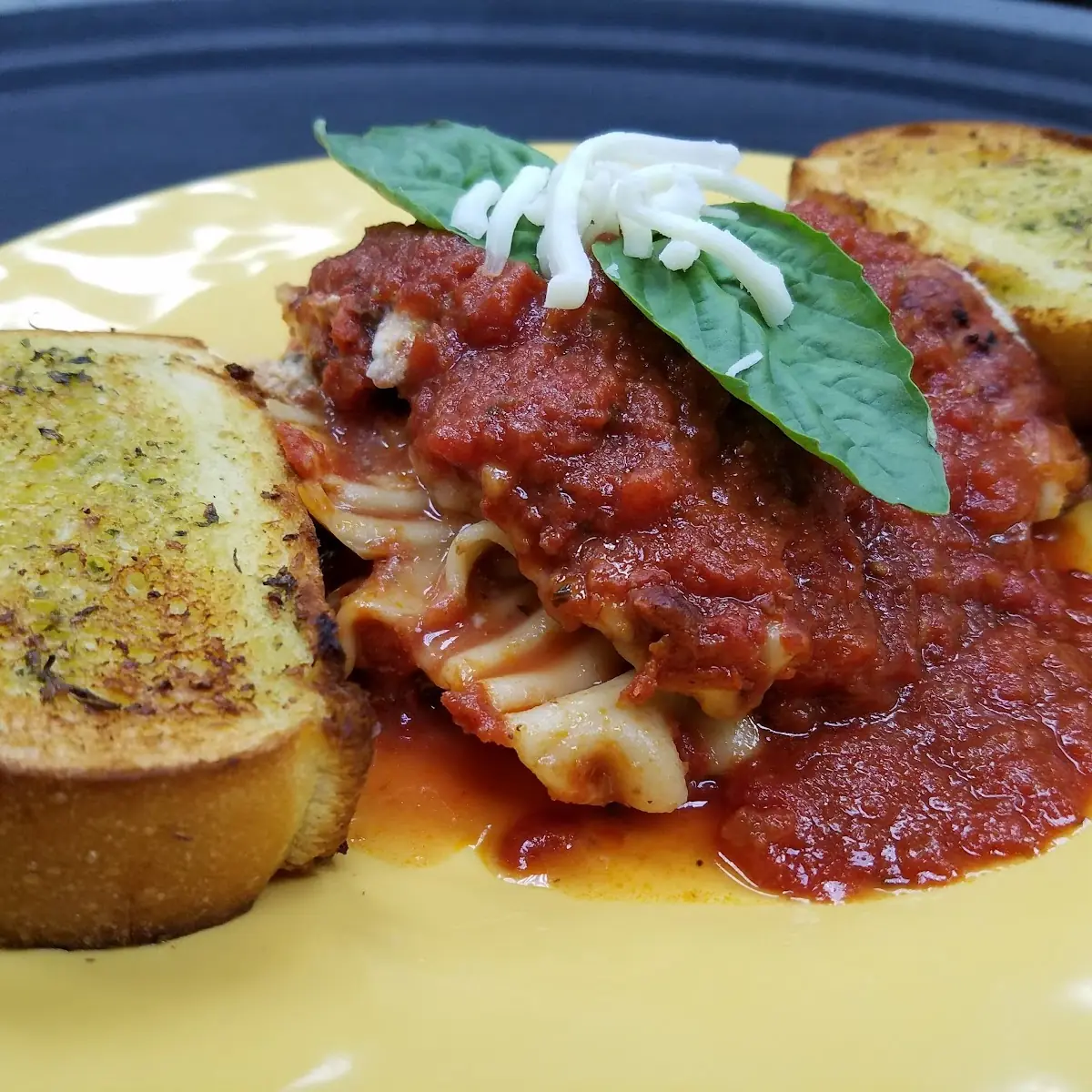 Homemade Lasagna Served with Garlic Bread
