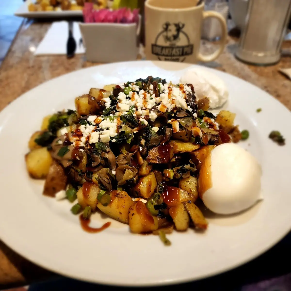 The Angela a Veggie Hash with a Couple of Poached Eggs