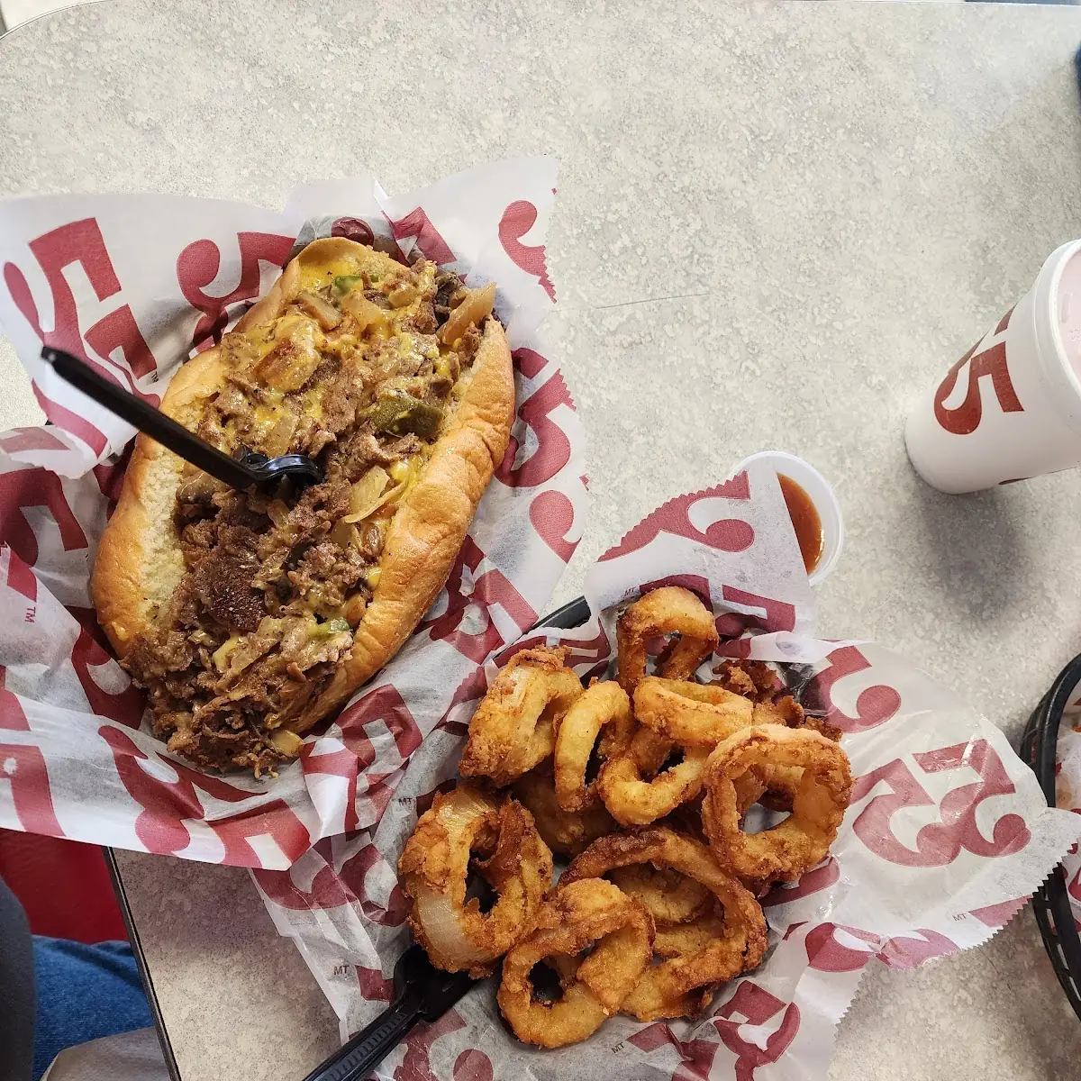 Philly Cheese Steak Sandwich and Onion Rings