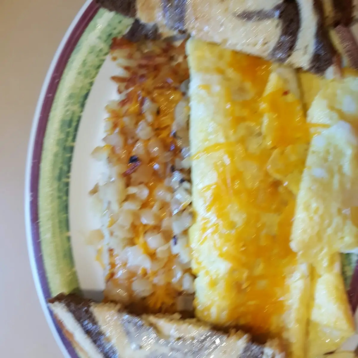 Meat Lovers Omelet with Hashbrowns and Sauteed Onions