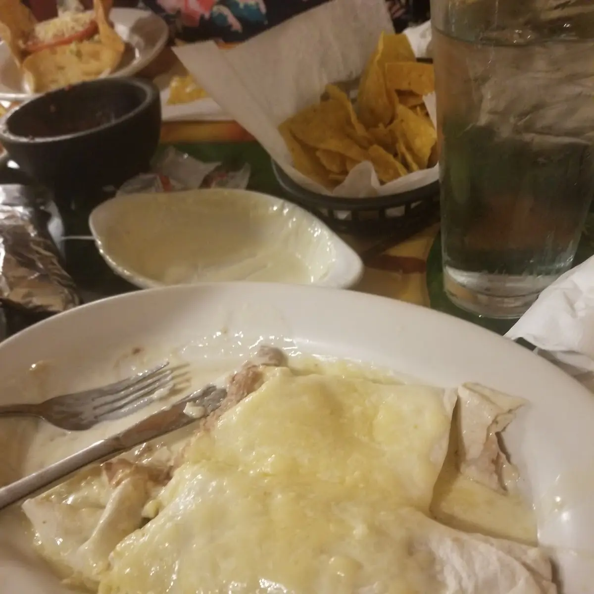Two Bean Burritos with Cheese Dip on Top