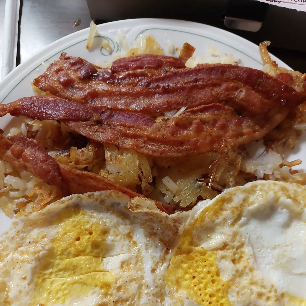 Eggs over Hard Well Bacon and Hash Browns
