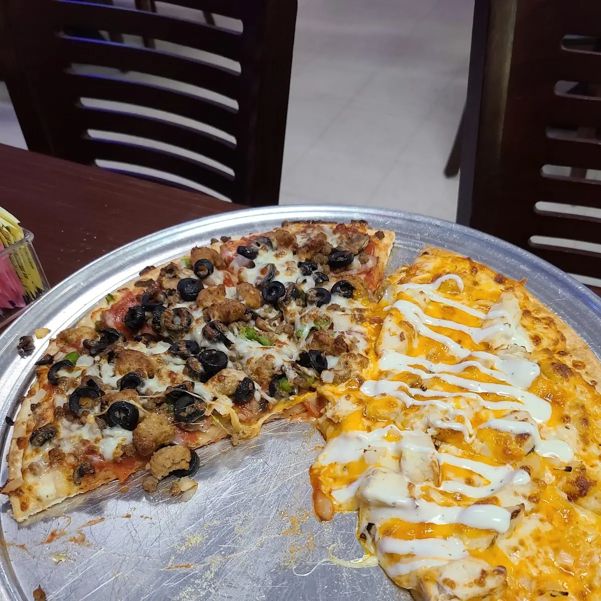 Half Supreme Pizza Half Buffalo Chicken Pizza