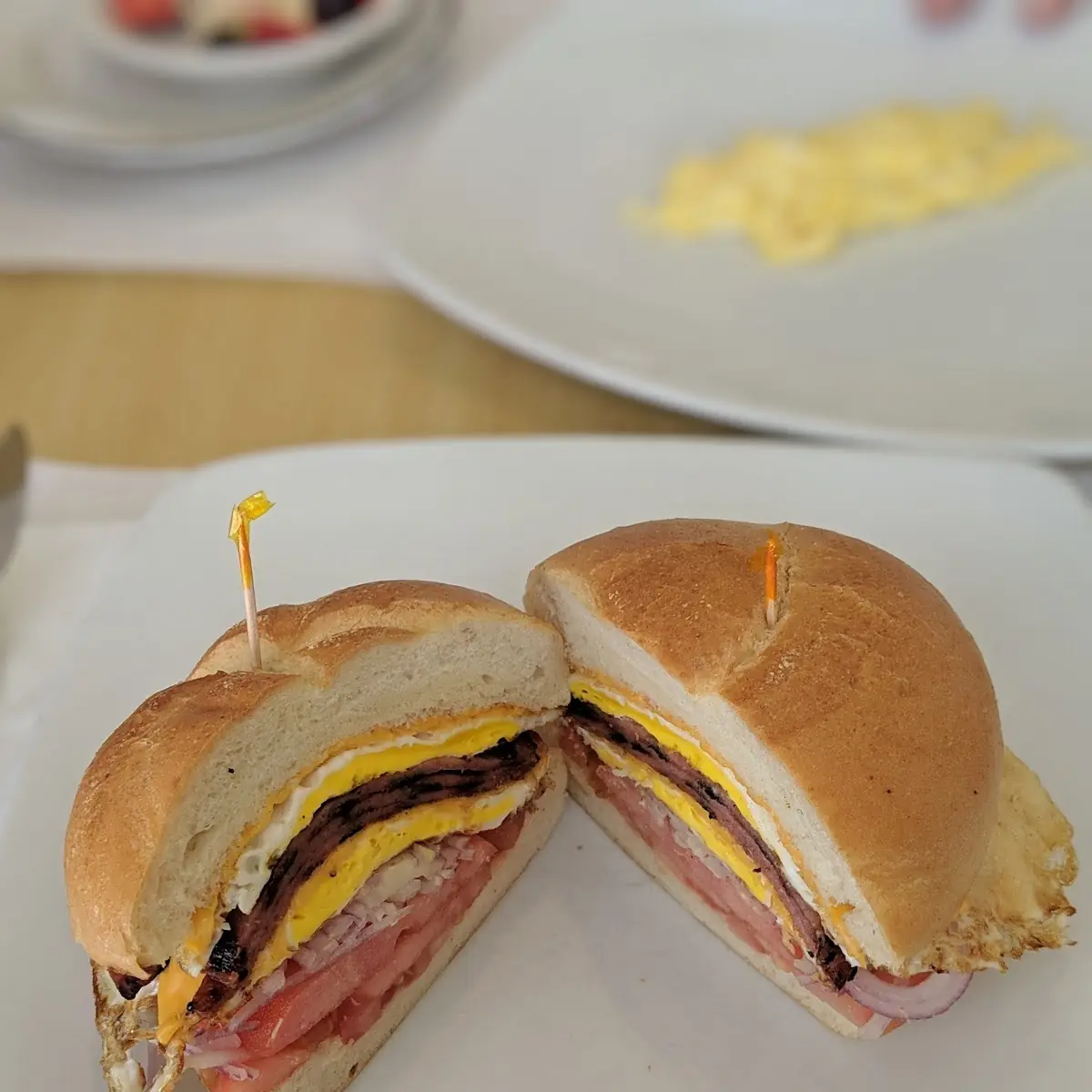 Tailor Ham Egg and Cheese with Raw Onion and Tomato
