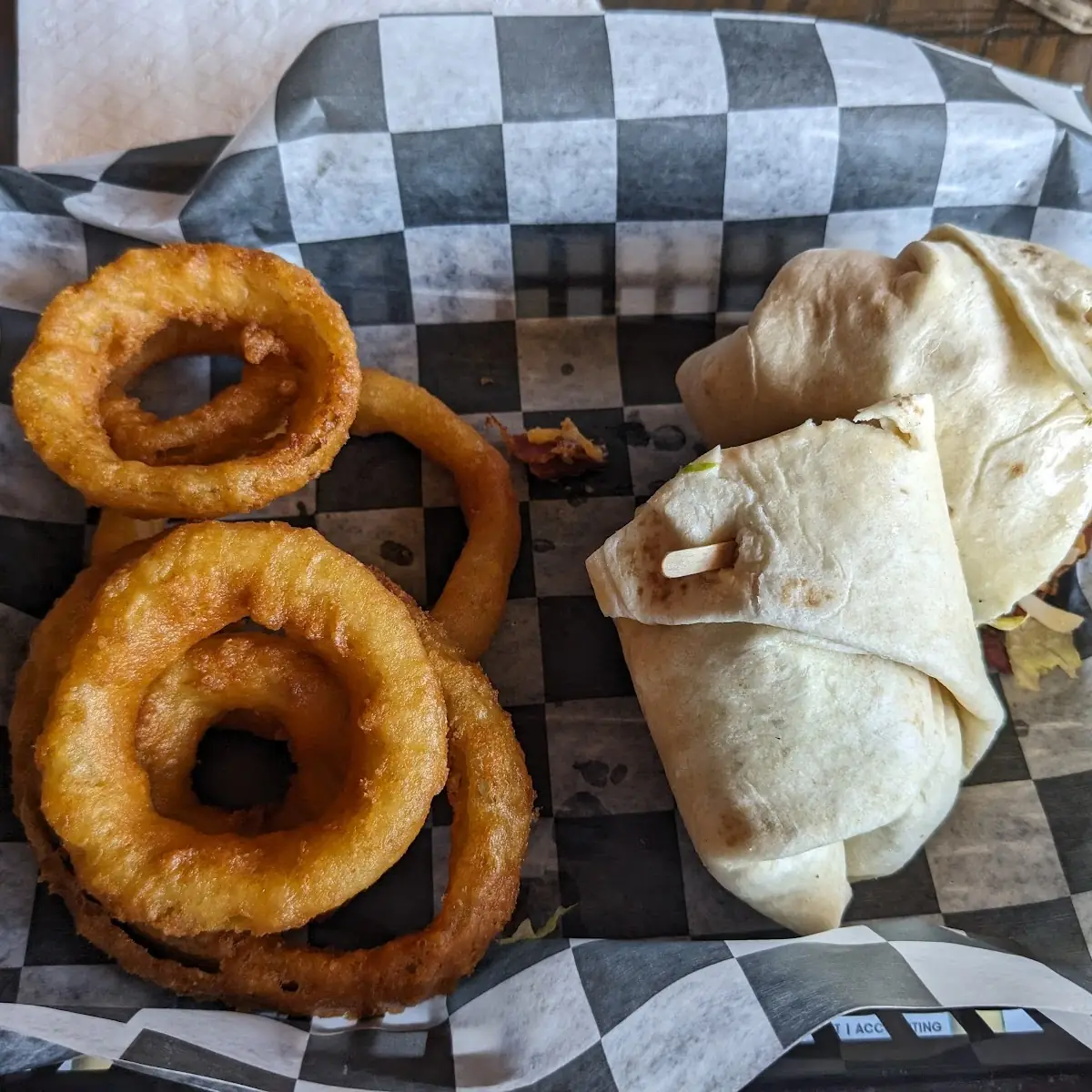 Gin Mill Wrap with Onion Rings and Chicken Caesar Wrap with Fries