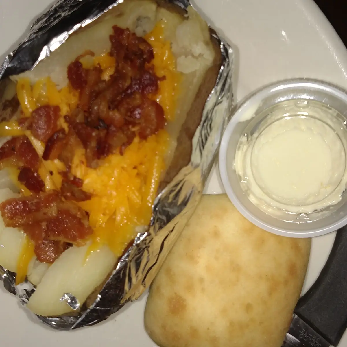 Rustler Cut Steak with Stuffed Potato and Roll