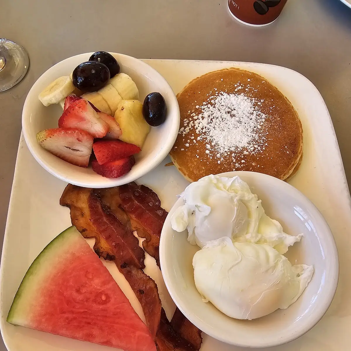 2 Poached Egg with Bacon Pancakes and Fruit