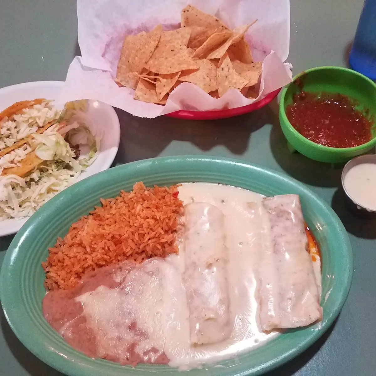 Chicken Enchiladas with Rice and Beans Two Beef Tacos