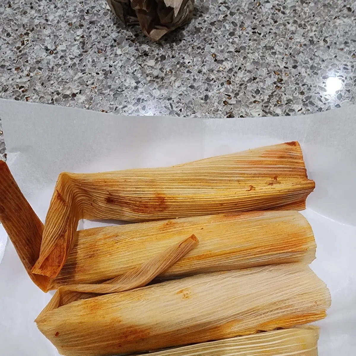 Three Chicken Tamales and One Corn Tamale
