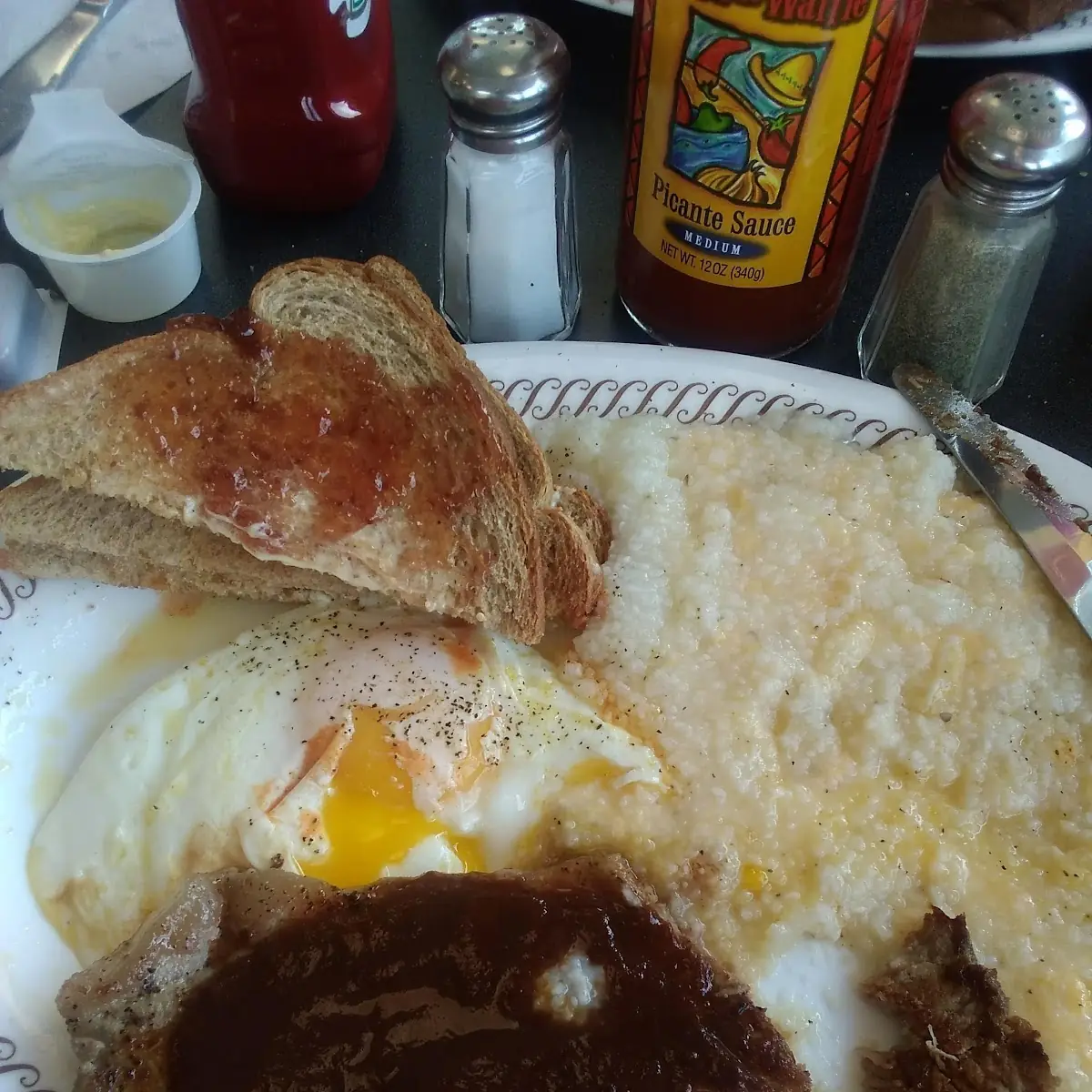 Grits with Rye Toast over Easy Eggs Any Style Steaks