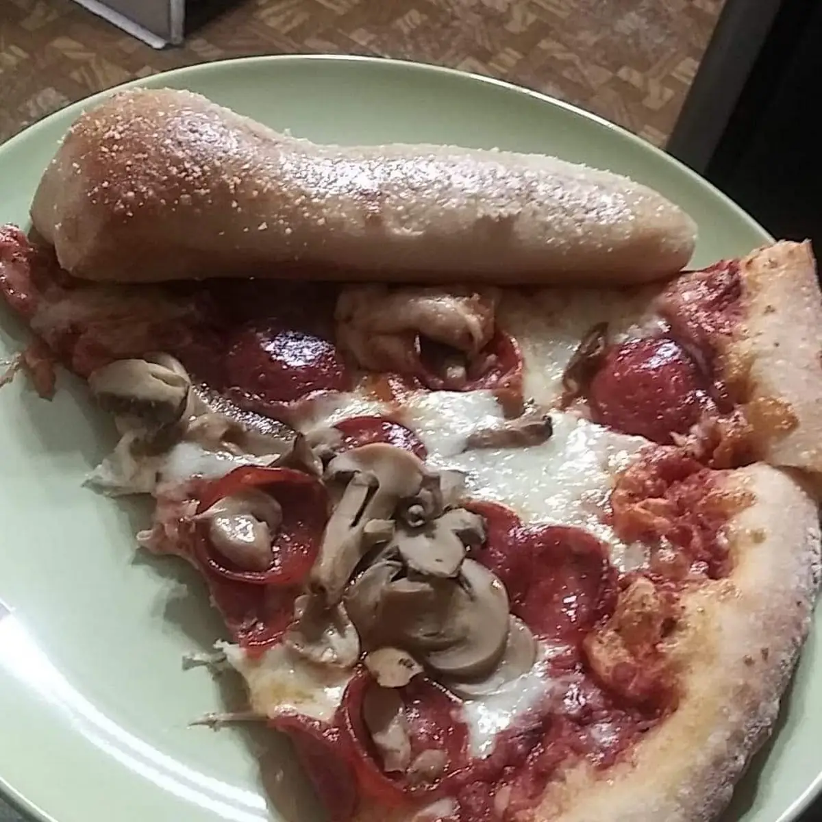 Round Pepperoni Mushroom Pizza with Breadsticks
