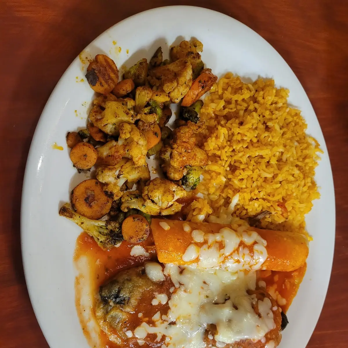 Combination Plate with Rice Steamed Vegetables Chile Rellano and Chicken Enchilada