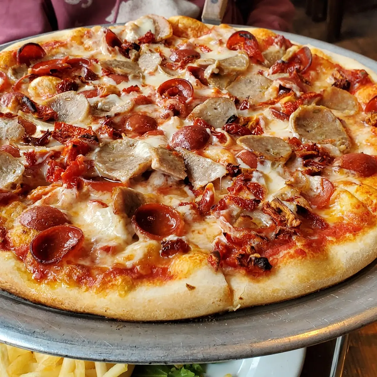 Medium Pizza w Sausage Pepperoni and Sun-Dried Tomatoes