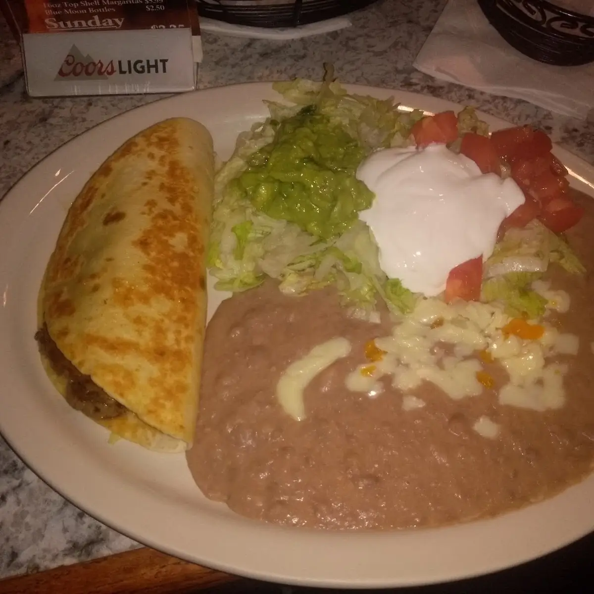 One Refried Bean Burrito One Cheese Enchilada and One Tostada with Refried Beans and Nacho Cheese