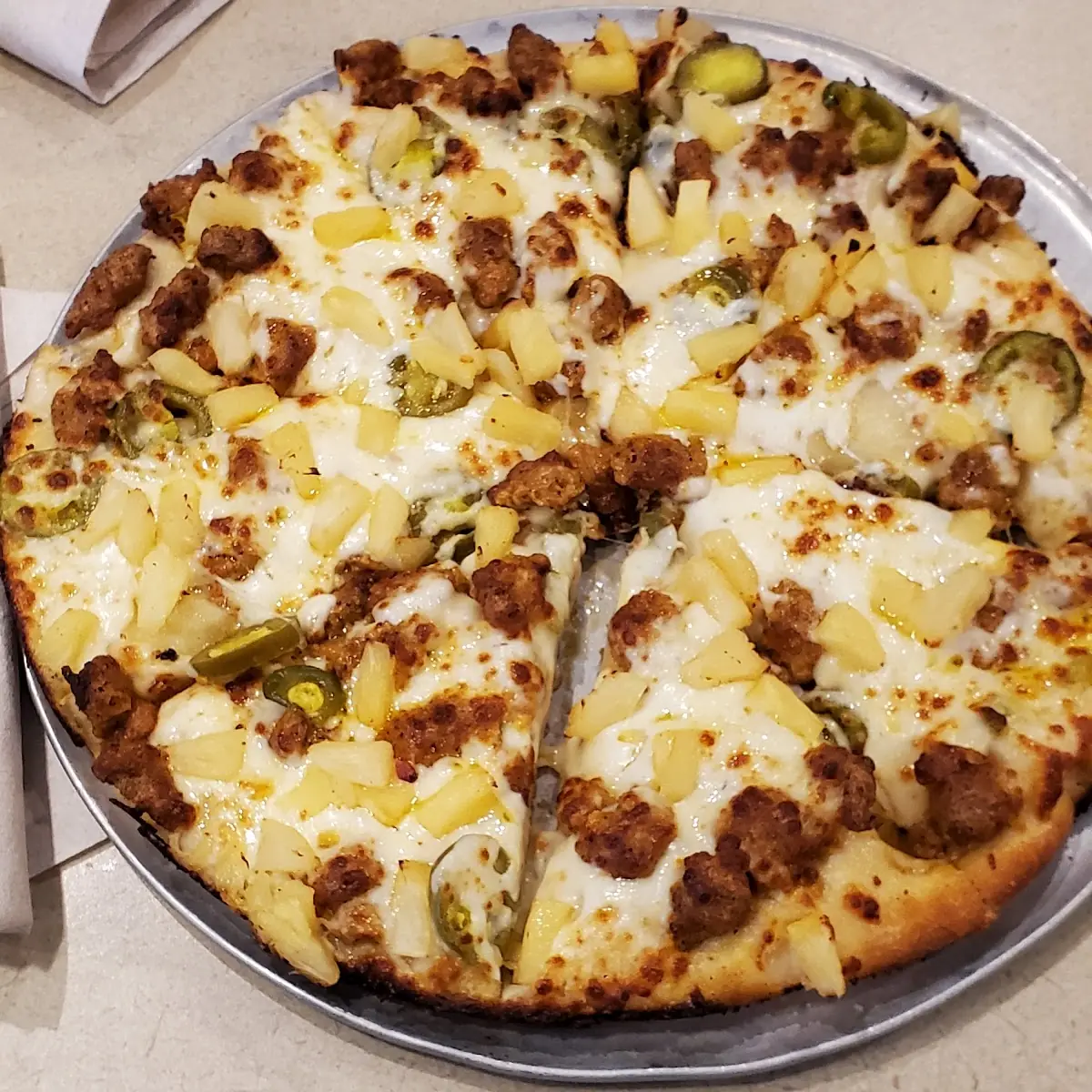 Pan Pizza with Spicy Sausage Jalapenos and Pineapple