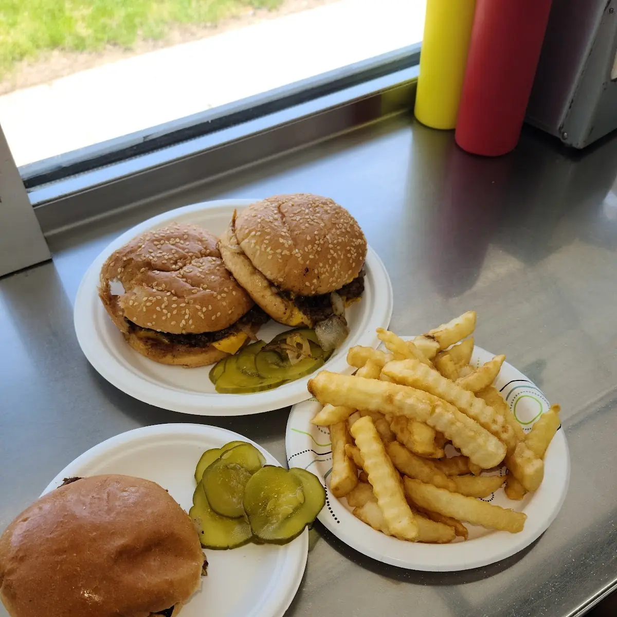 2 Double Hamburgers with Grilled Onions Pickles and Crinkle French Fries