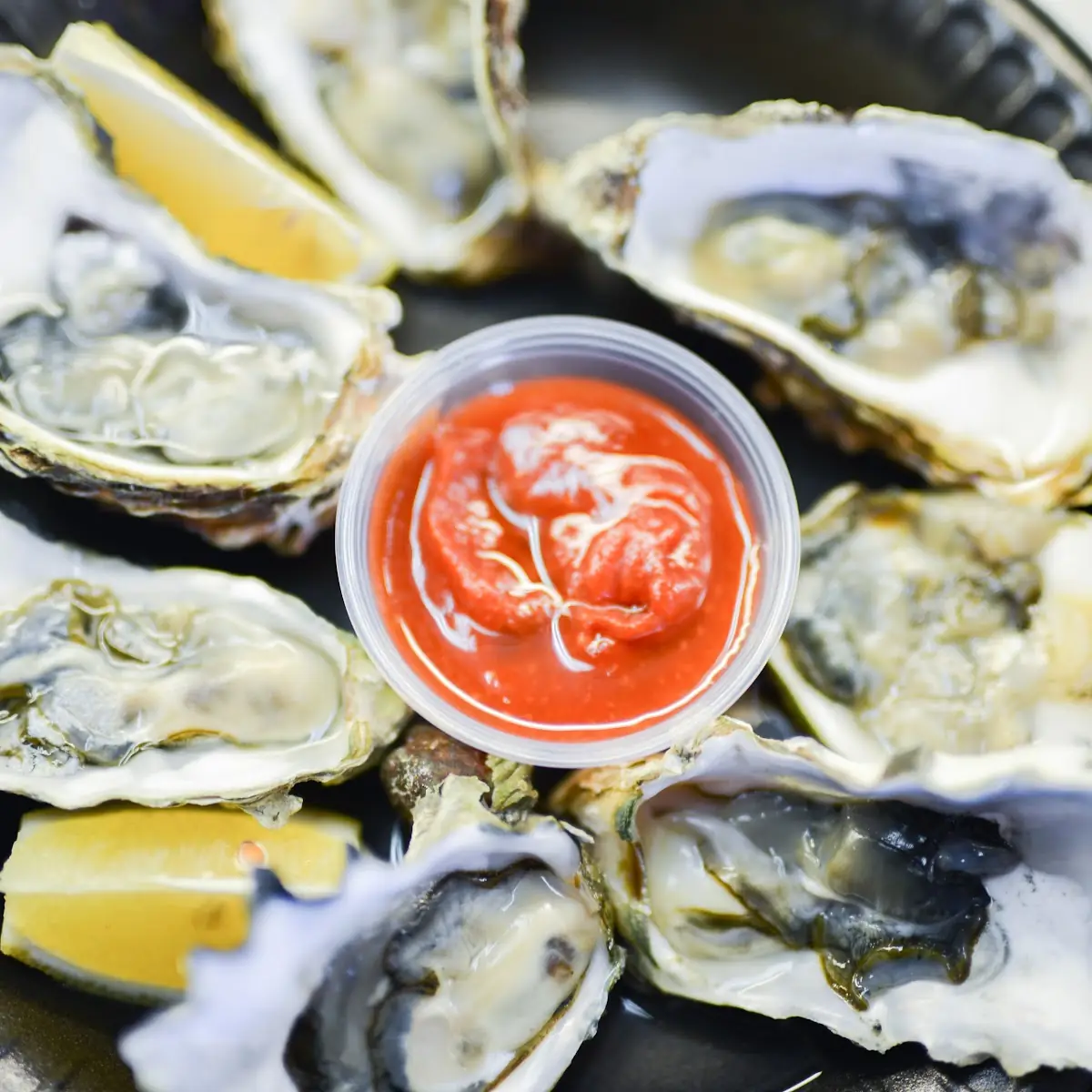 Raw Oysters with Lemon Wedges