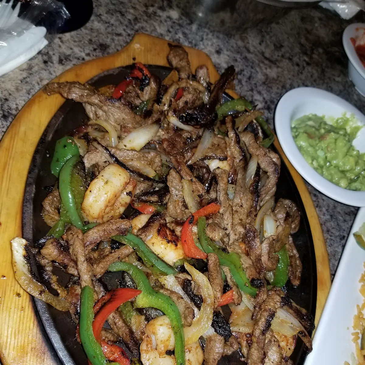 Shrimp Chicken and Steak Fajitas