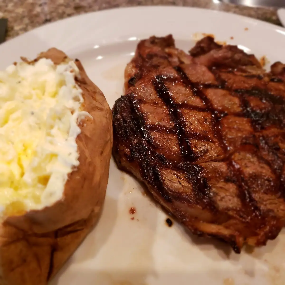 10 Oz Ribeye with Baked Potato