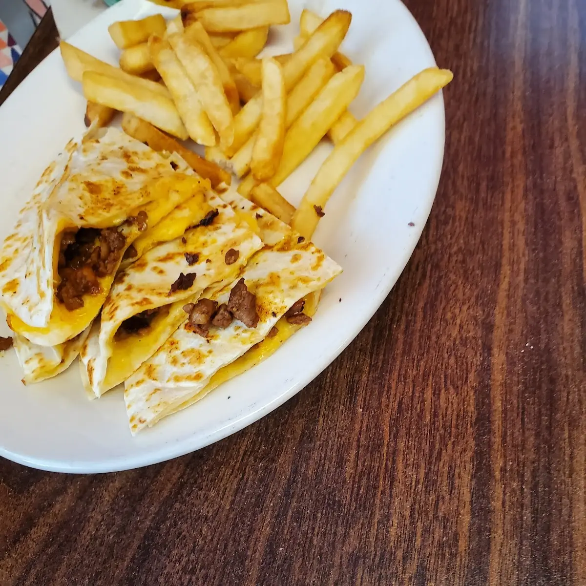 Una Quesadilla con Arroz y Frijoles o con Papas / Cheese Quesadilla with Rice and Beans or Fries