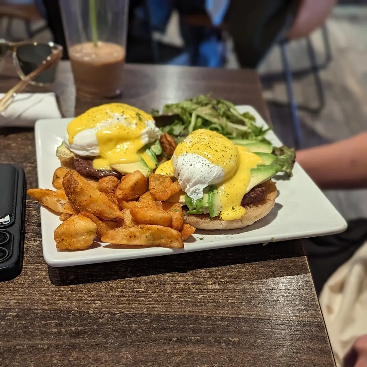Eggs Benedict with Breakfast Potatoes and Greens