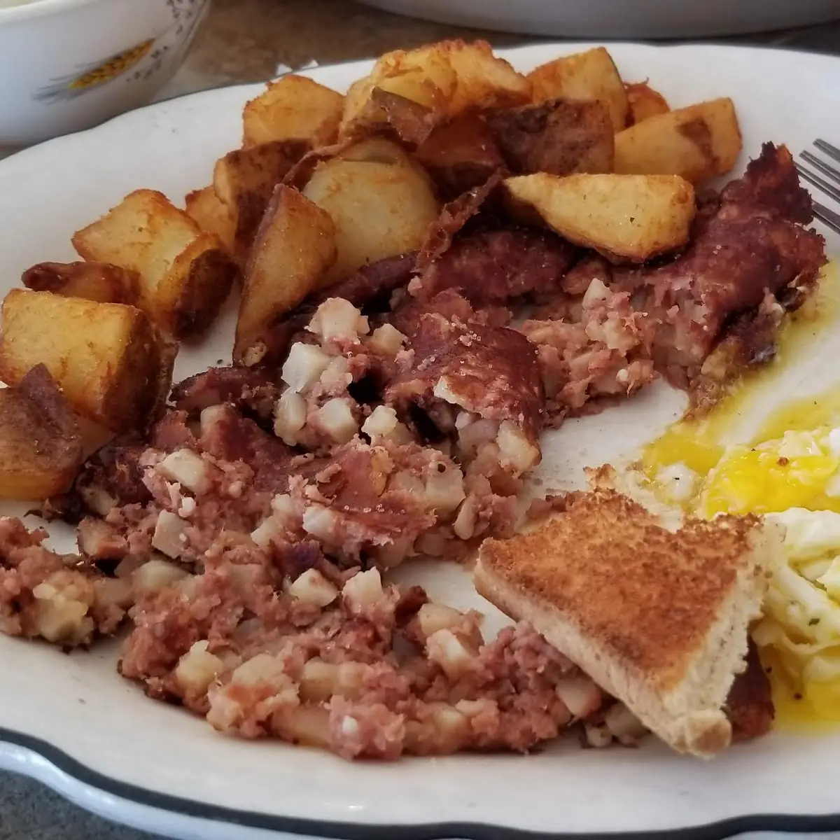 Corn Beef Hash Home Fries Eggs and Toast