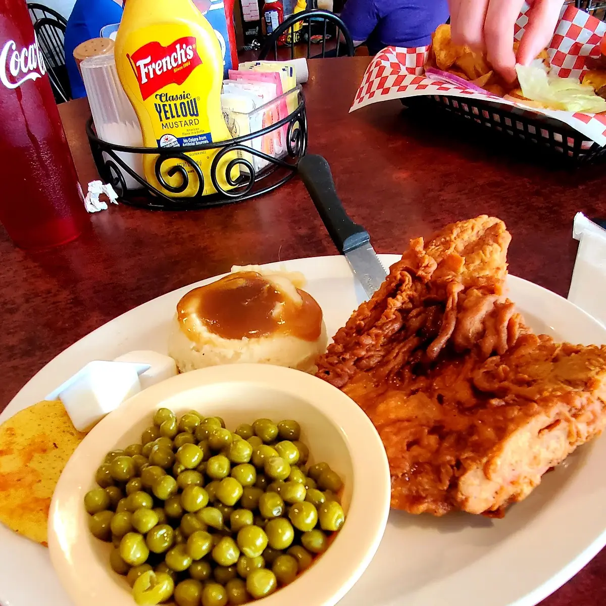 Fried Pork Chops Mashed Potatoes Peas and Cornbread