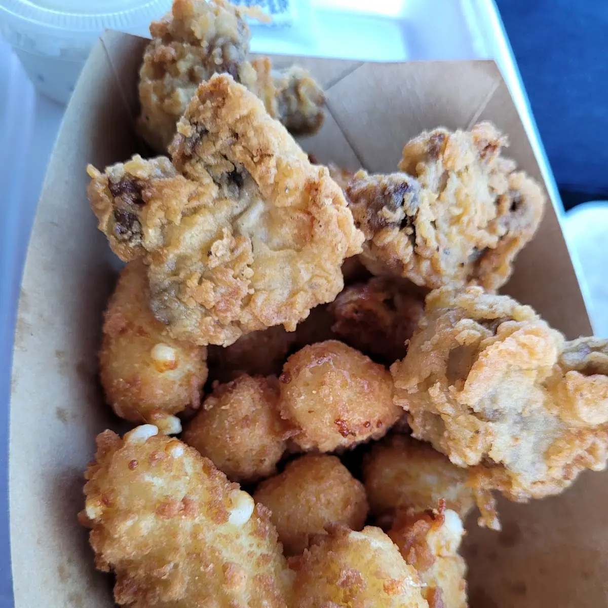 Cheese Curds with Some Fried Mushrooms on Top
