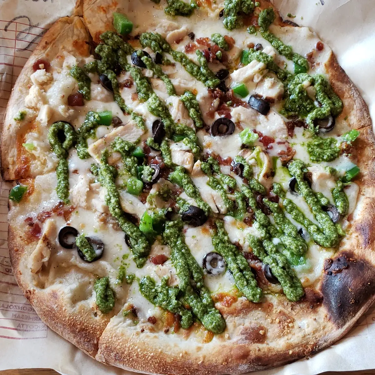 Garlic Rub White Sauce Mozzarella & Parmesan Cheese Chicken Bacon Olives Pesto Drizzle