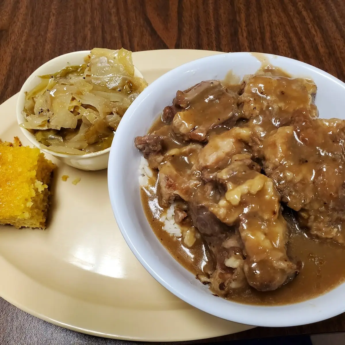 Oxtails over White Rice Cabbage and Cornbread