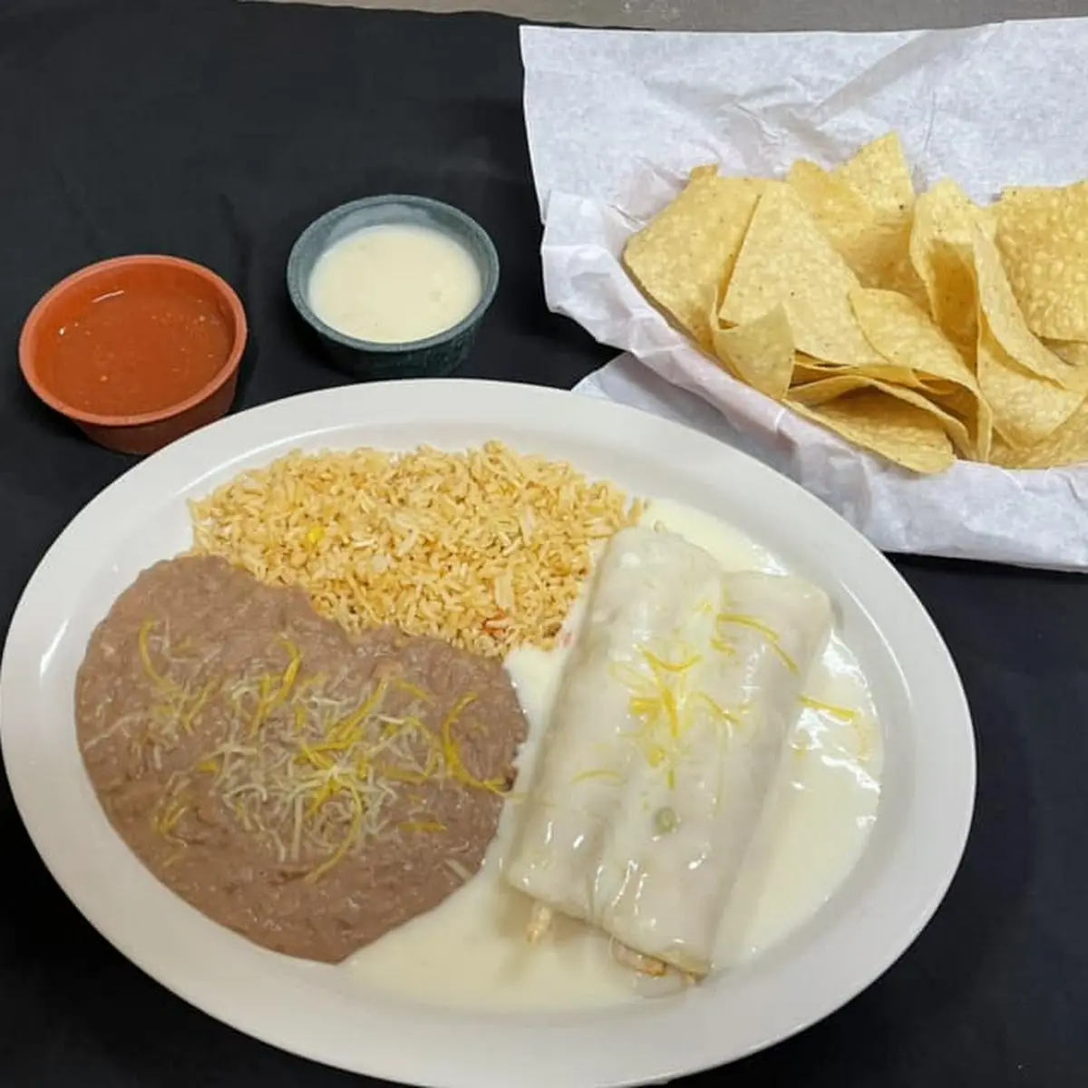 Beef and Cheese Enchiladas with Rice and Beans
