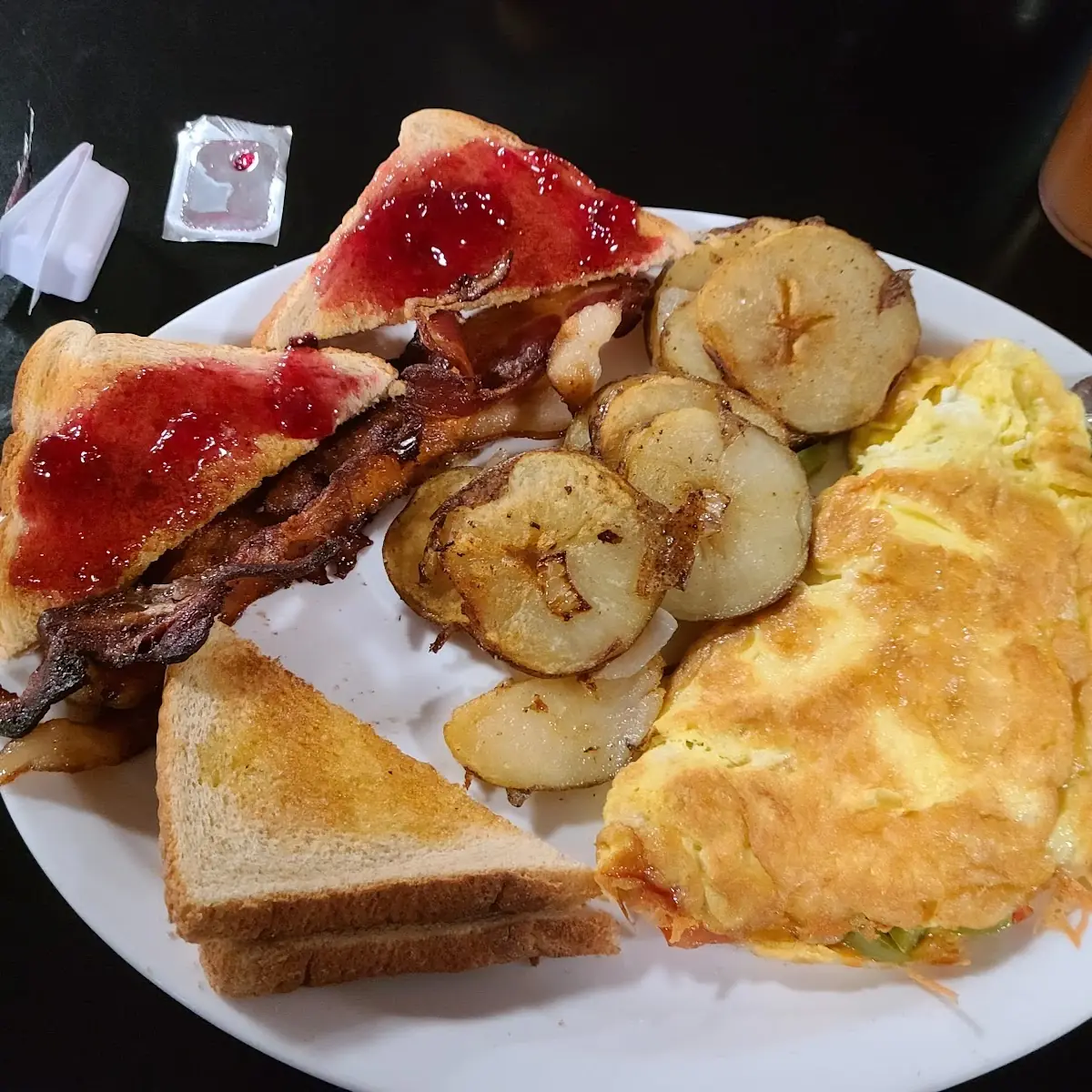 Veggie Omelette w German Taters Bacon and Toast