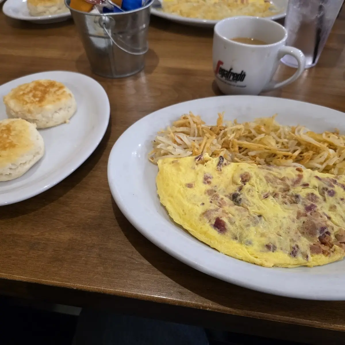 Bacon and Cheese Omelet with Hash Browns and Biscuits