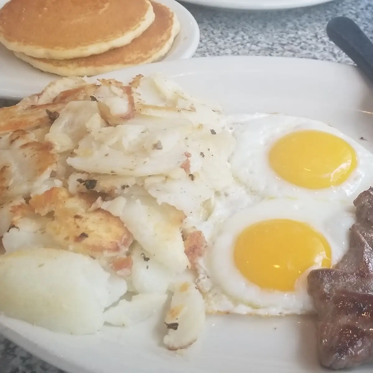 Skirt Steak Fried Potatoes Eggs and Pancake Breakfast