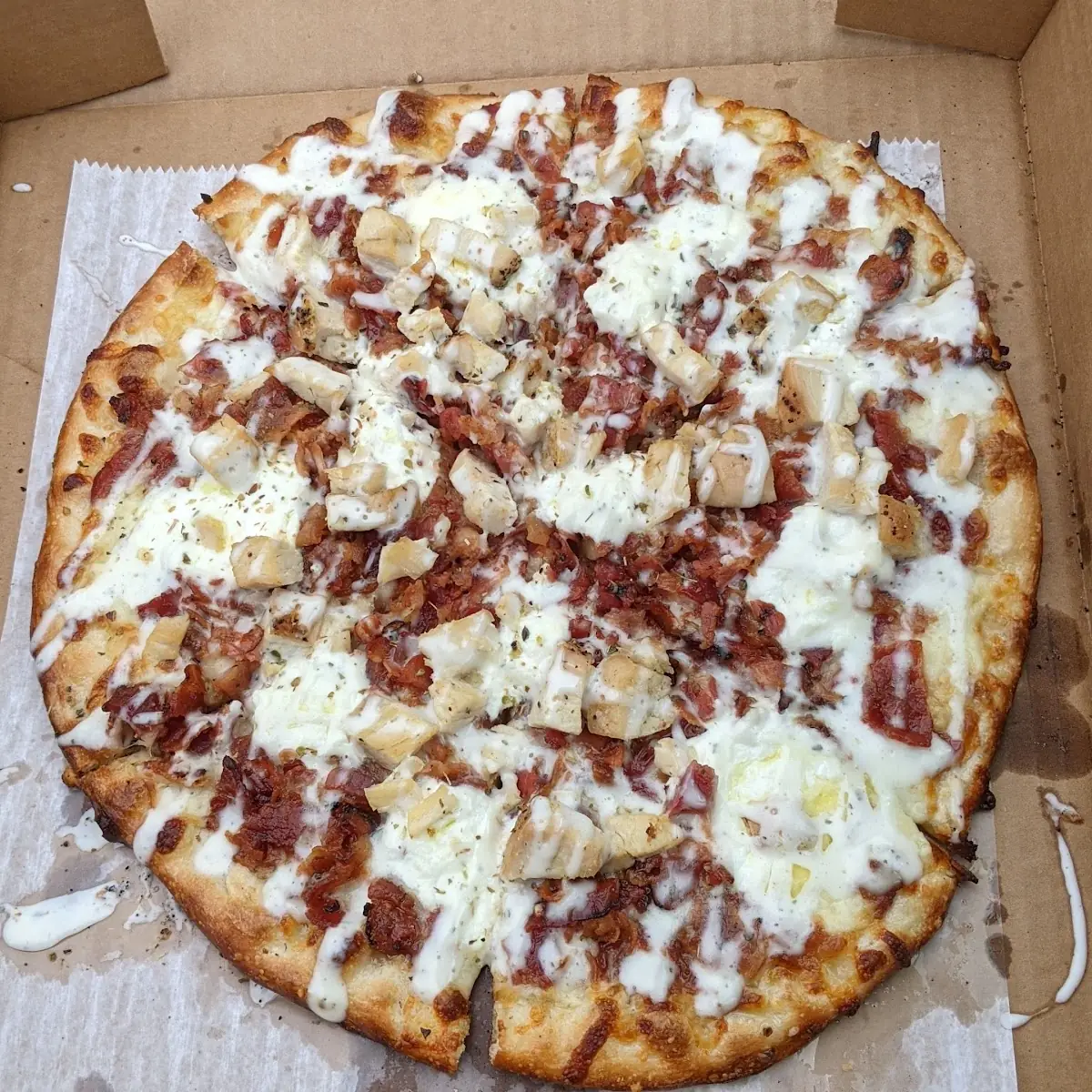 White Pizza with Chicken Bacon and Ranch Drizzle