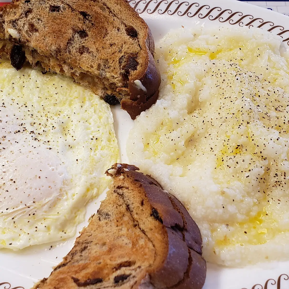 2 Eggs over Medium with Bacon Grits and a Waffle