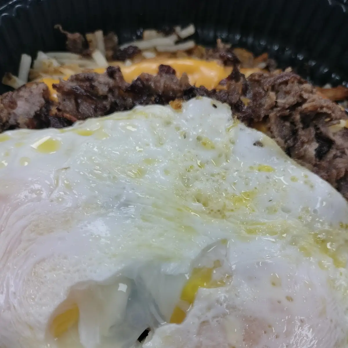 Steak Cheese Melt Bowl with over Easy Eggs