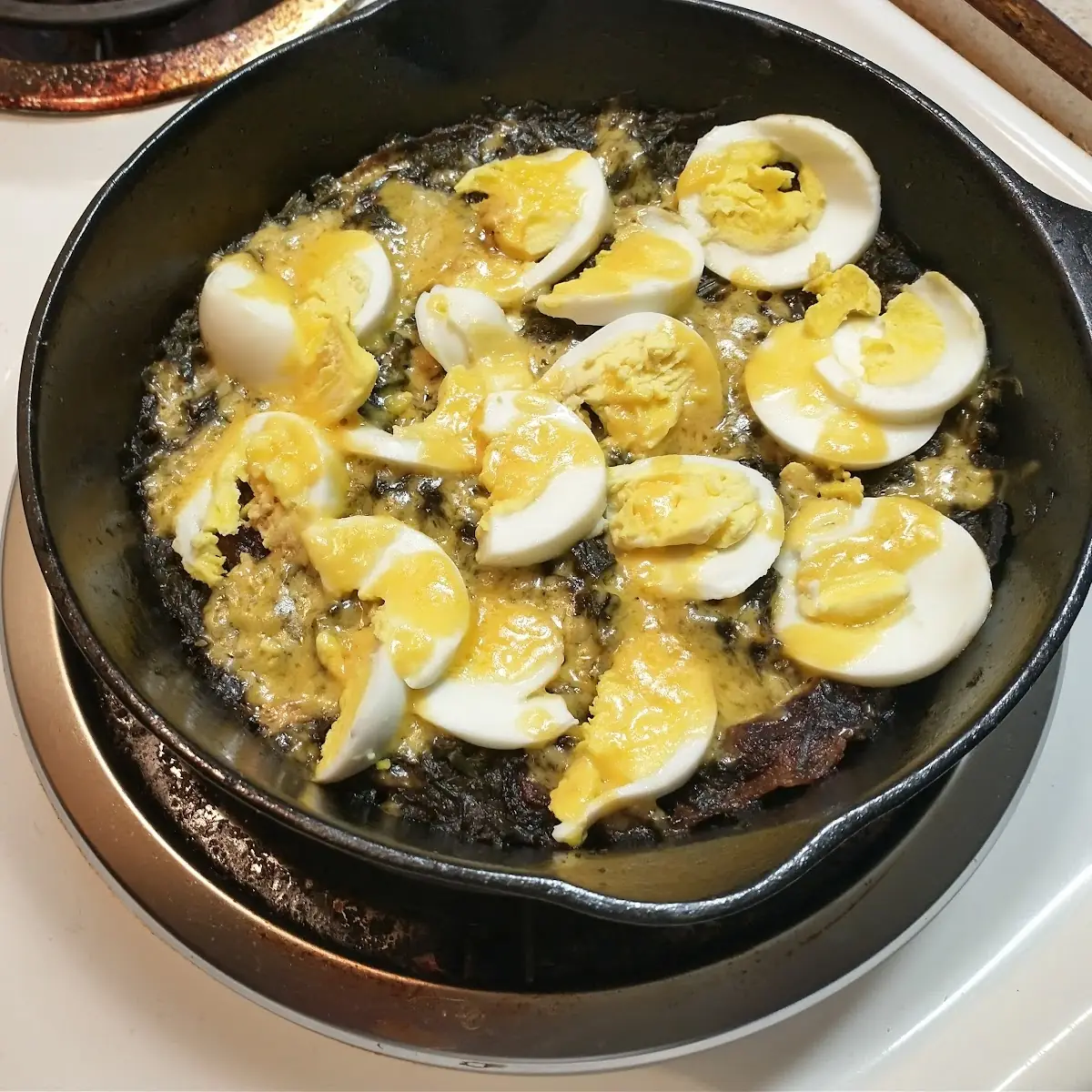 Fried Spinach with Bacon Cheese and Sliced Boiled Eggs