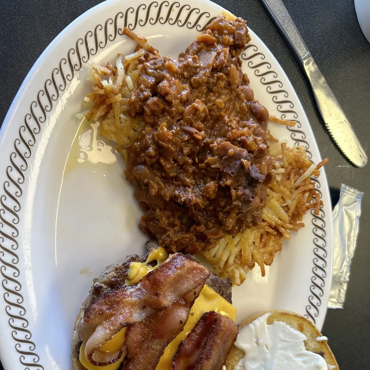 Bacon Cheeseburger and Hash Browns Topped with Chili