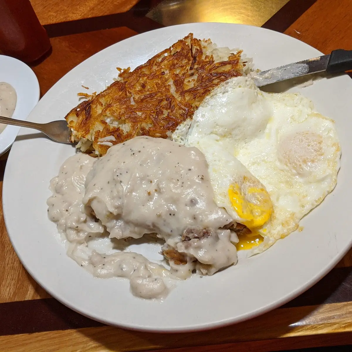 Chicken Fried Steak Eggs and Biscuit Smothered in Sausage Gravy