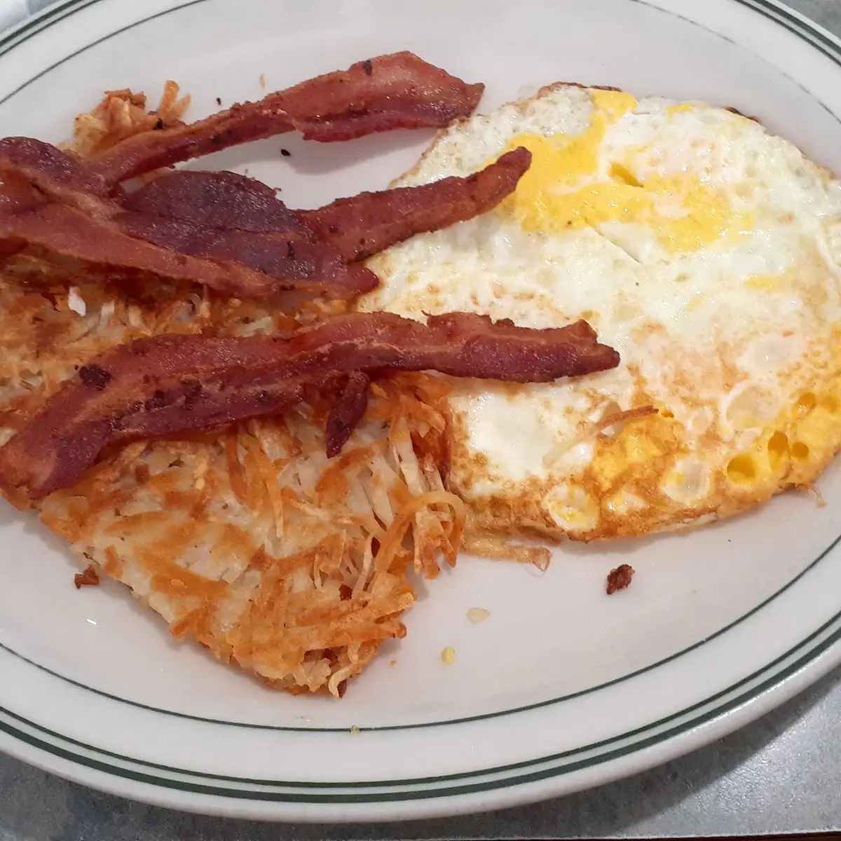 Denver Omelette with Four Fresh Whipped Eggs Sauteed Bell Peppers Chopped Onions and Ham