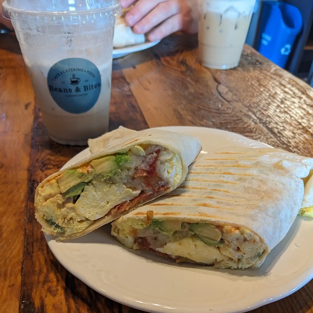 Breakfast BOWL - A generous portion of scrambled eggs, green pepper, onion, pepper jack cheese, hashbrowns, homemade chipotle sauce, and your choice of bacon or sausage.
