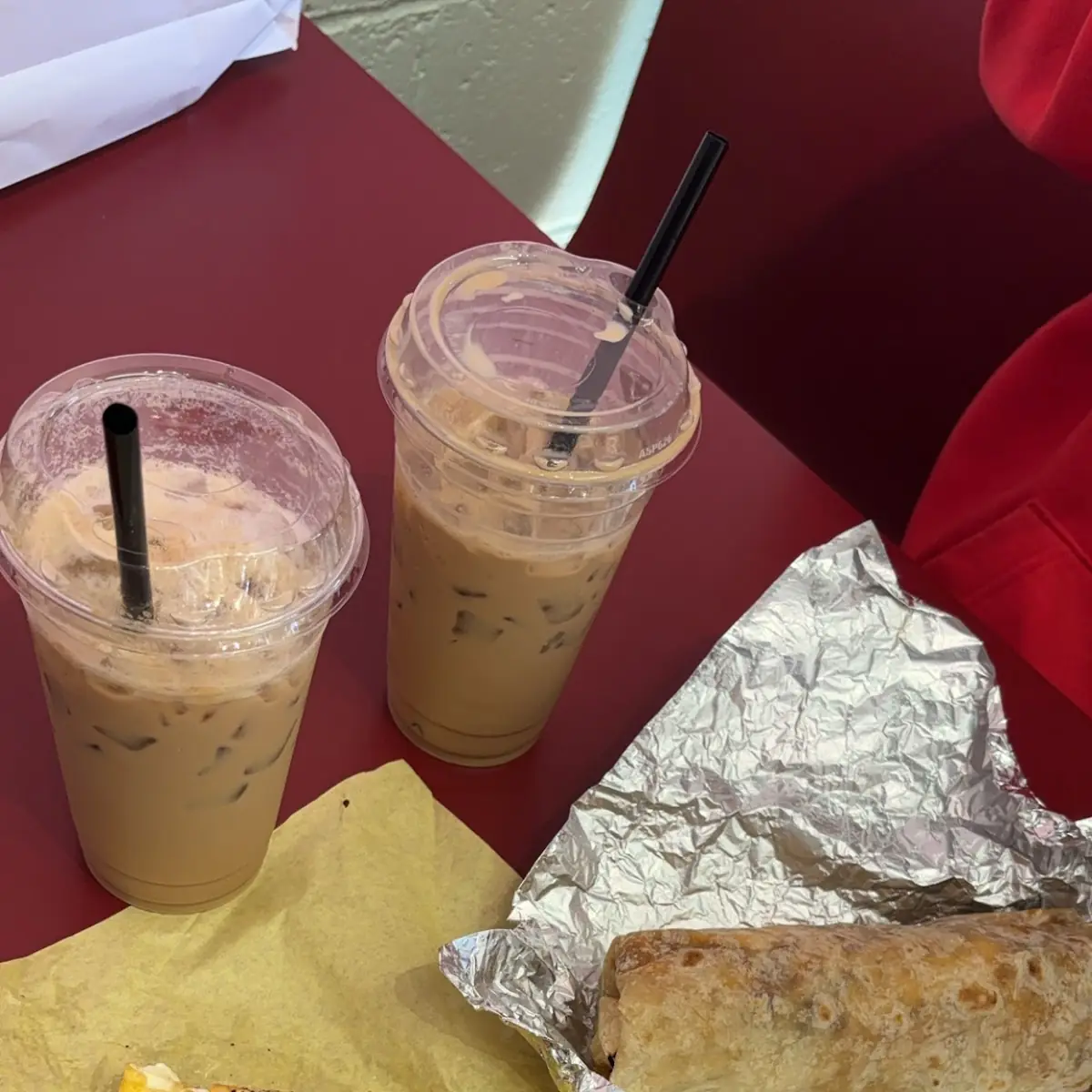 Vietnamese Coffee Spicy Breakfast Burrito and a Everything Bagel with Bacon Sausage Egg and Cheese