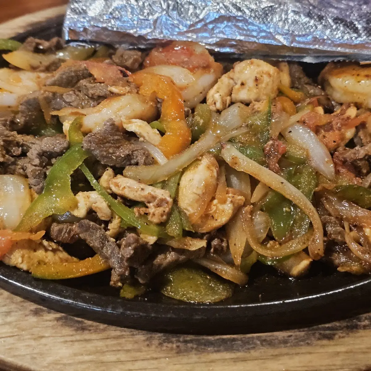 Steak Chicken and Shrimp Fajitas