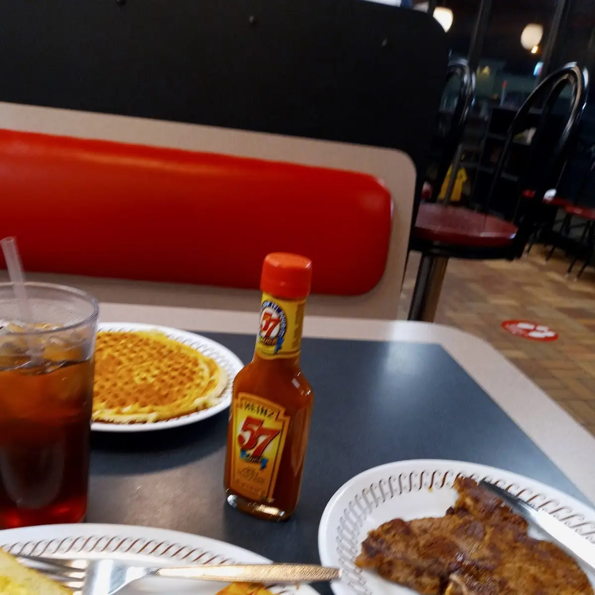 T-Bone Steak and Eggs Hash Brown with Ham in It Sweet Tea and a Waffle
